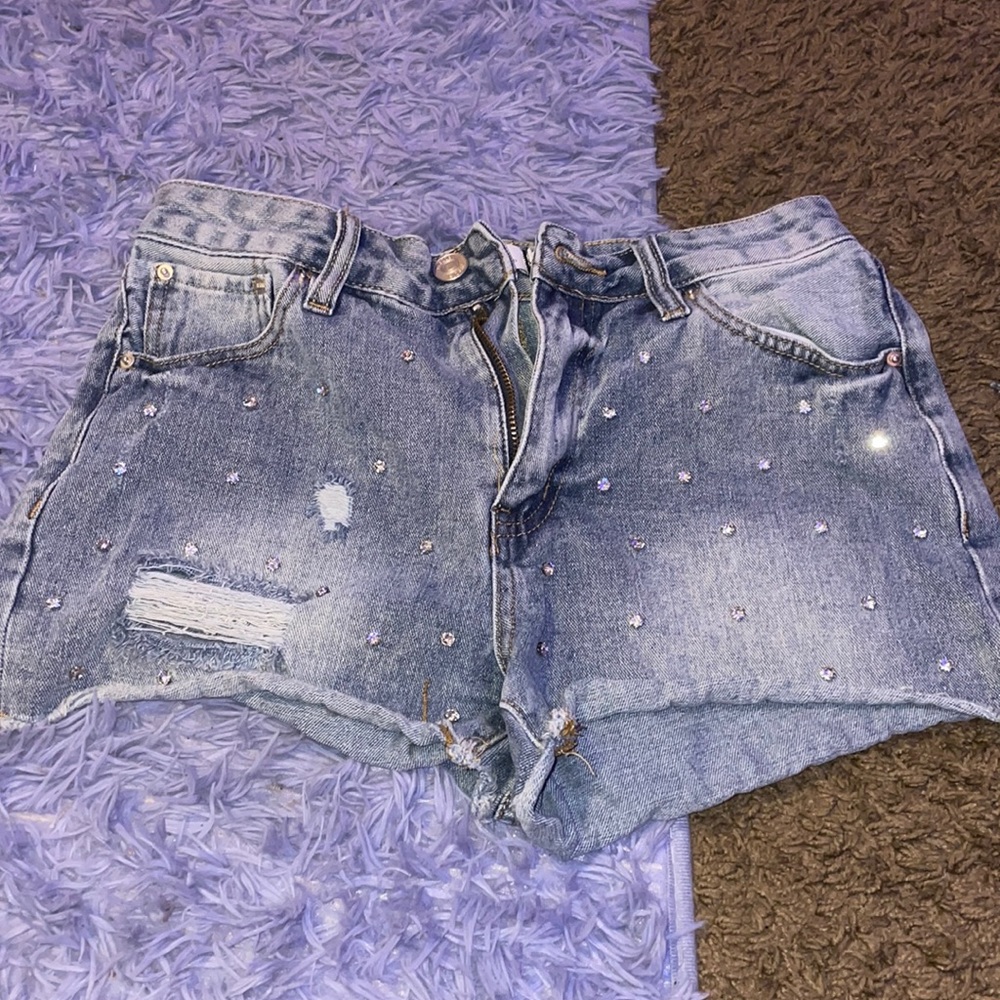 Light washed blue jean shorts, size 6 in women’s.